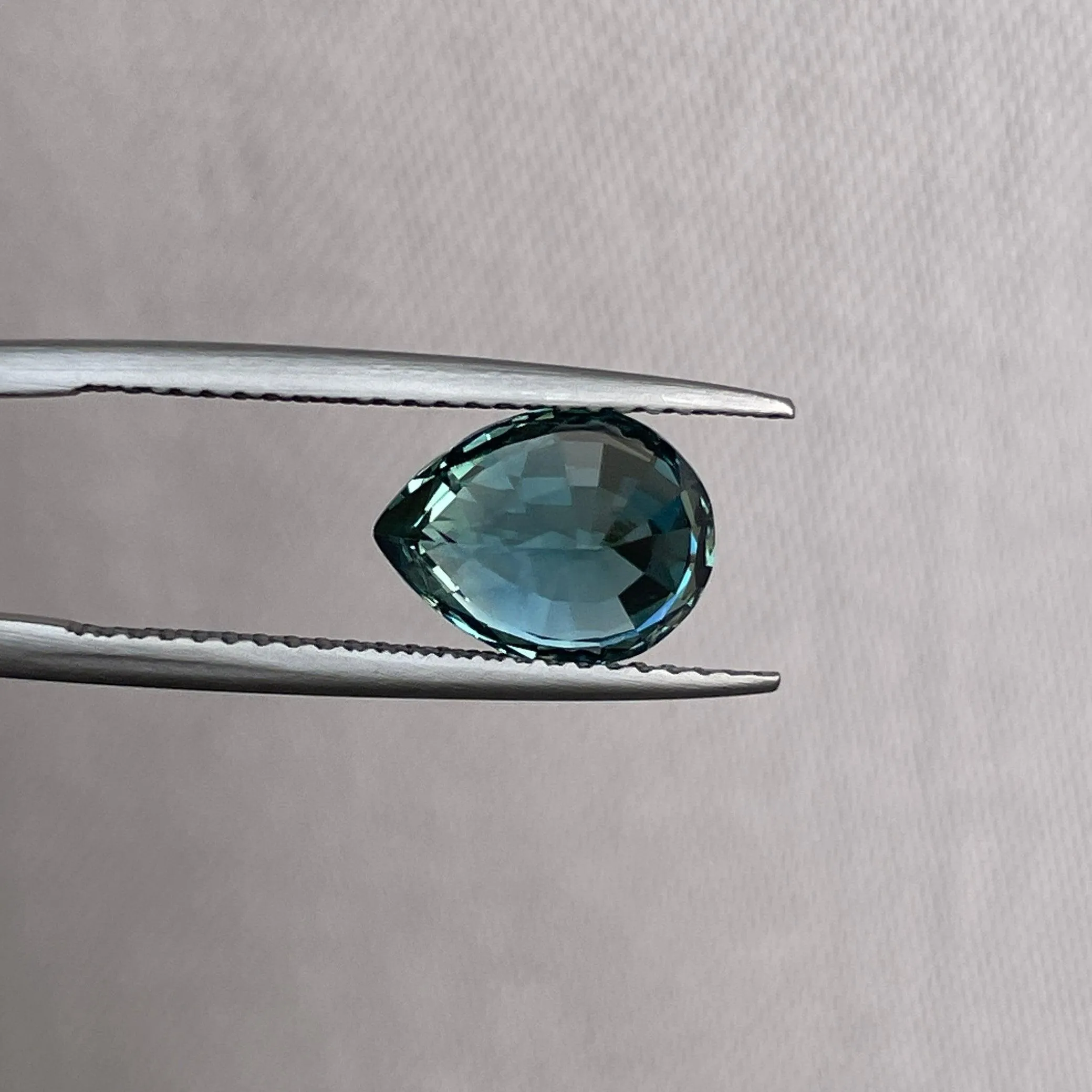 3.18 Carat Teal Sapphire Pear shape. Clean stone.
