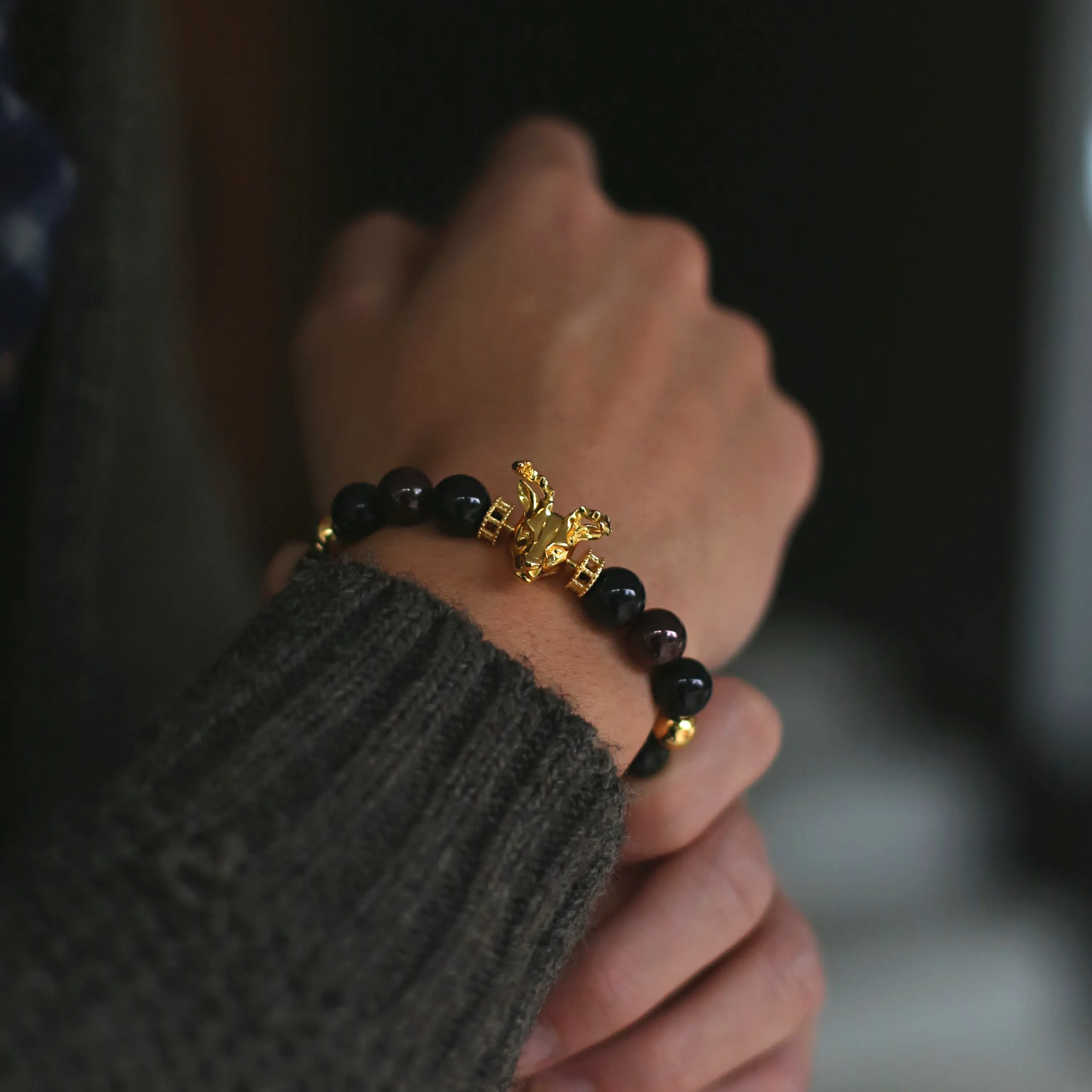 Gold Deer, obsidian, garnet bracelet with gold connector
