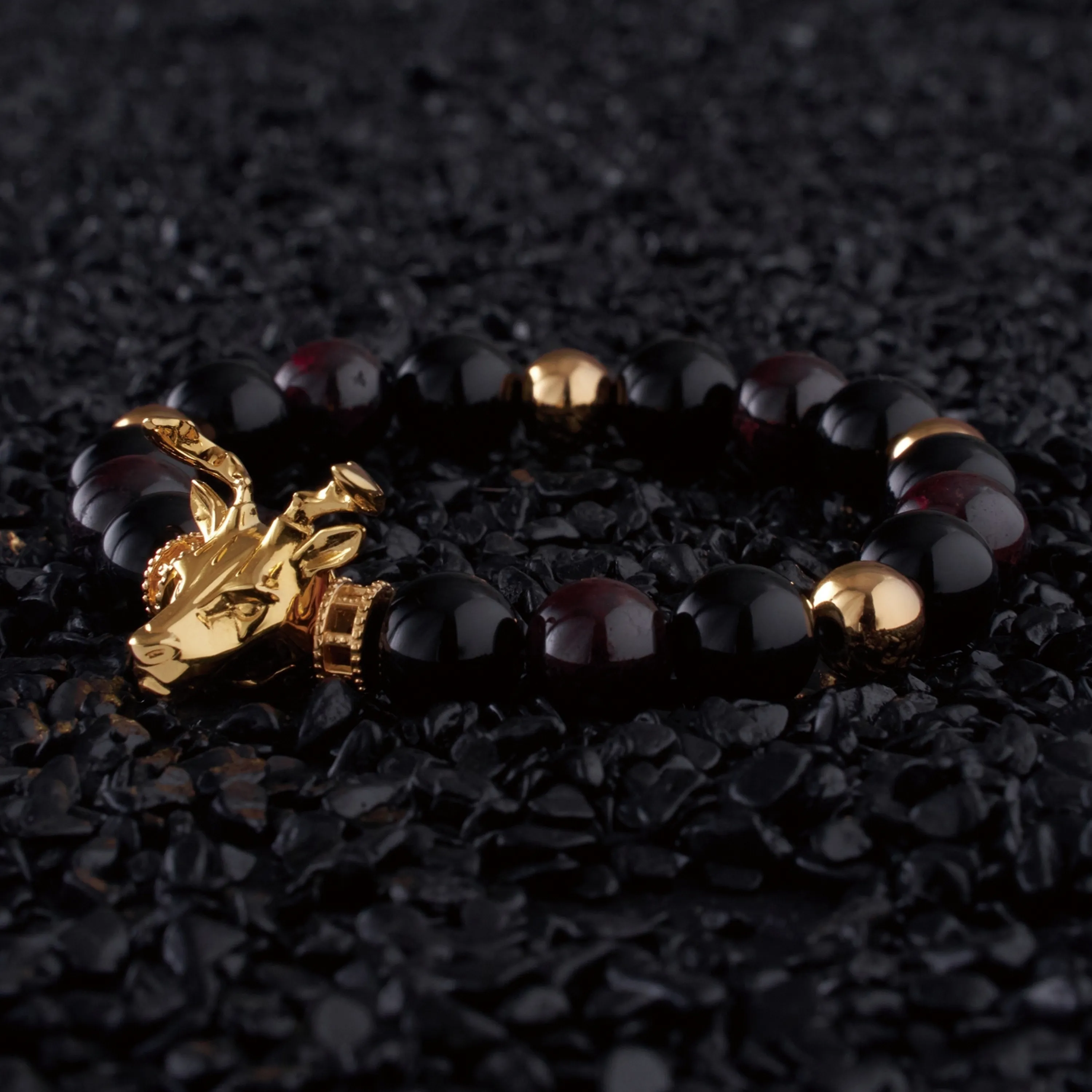 Gold Deer, obsidian, garnet bracelet with gold connector