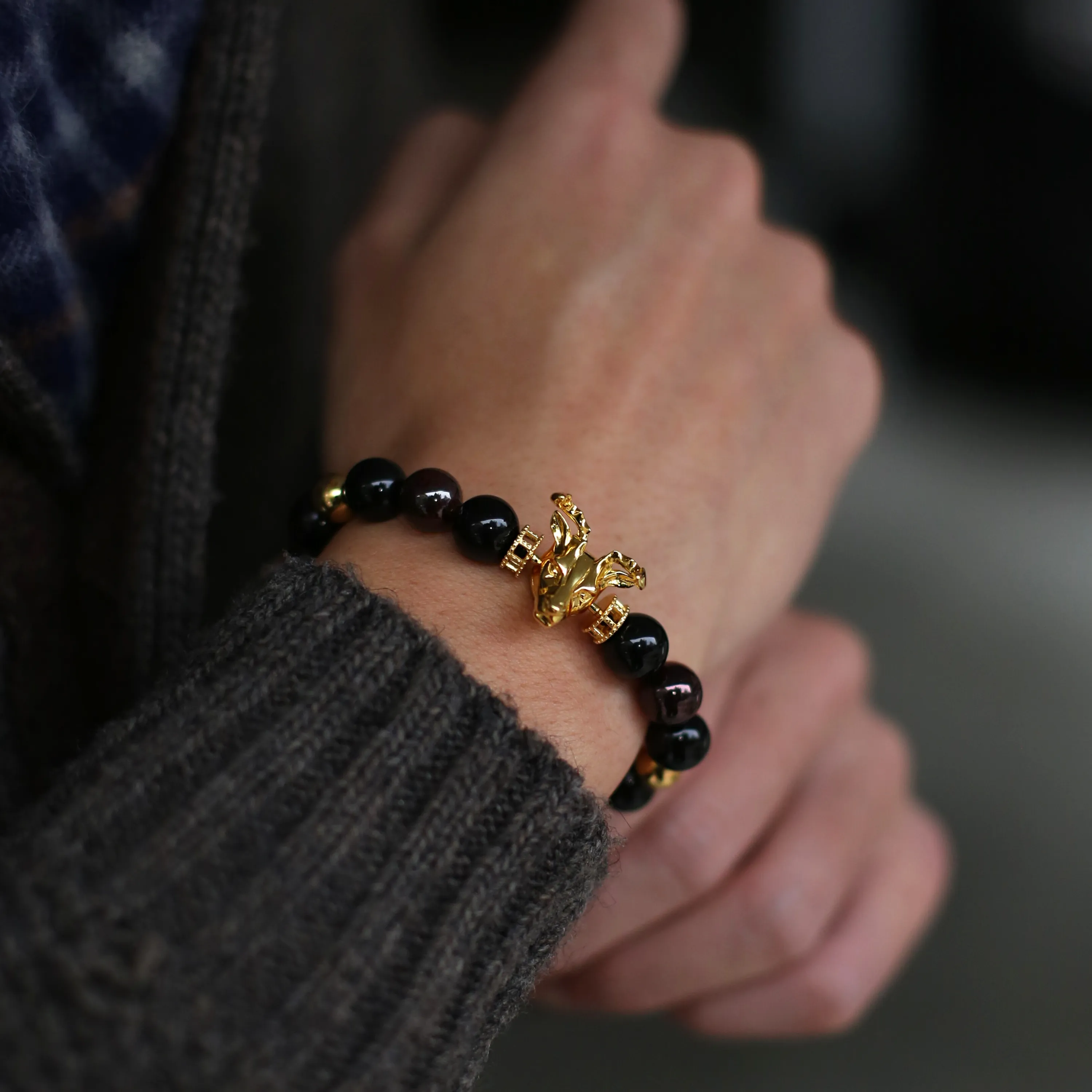 Gold Deer, obsidian, garnet bracelet with gold connector